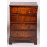 An early 20th century walnut four drawer chest, in the early 18th century style,