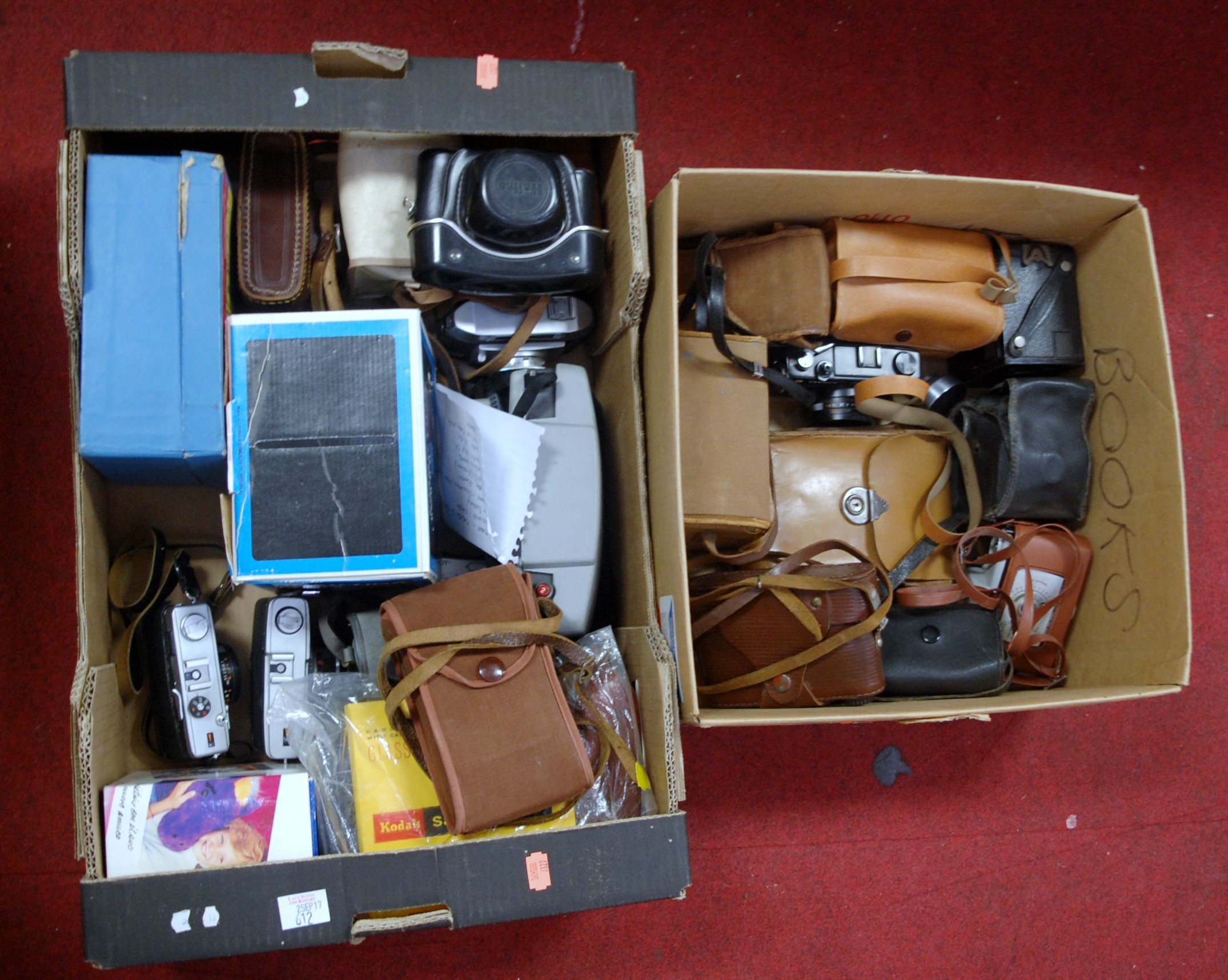 Two boxes of assorted cameras to include Yashica Electro 35,