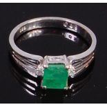 A contemporary 14ct white gold, emerald and diamond dress ring,