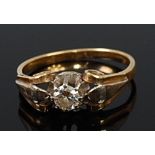 A yellow metal diamond solitaire ring, the claw set brilliant weighing approx. 0.