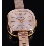 A ladies Rolex 18ct gold cased cocktail watch having a signed silvered dial, baton markers,
