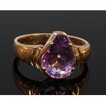 A ladies 9ct gold amethyst set dress ring, the claw set pear cut amethyst weighing approx 2.5ct, 3.