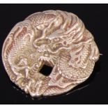 A Japanese Meiji period silver brooch, possibly converted from a button,