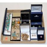 A collection of assorted costume jewellery to include silver paste set daisy head ring,