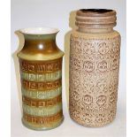 A large West German pottery vase of cylindrical form on a cream ground with all over geometric