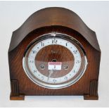 A 1930s oak cased mantel clock,