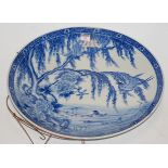 A large early 20th century blue & white charger decorated with various birds amongst foliage dia.