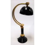 A modern lacquered brass and black painted adjustable desk lamp