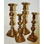 A pair of 19th century turned brass candlesticks, stamped England and numbered 223580, h.