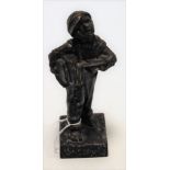 A reproduction cast iron figure of a paper-boy on plinth, entitled Speshul,