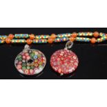 Two Baccarat style glass pendants together with a beaded glass and enamel necklace (3)