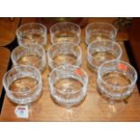 A set of nine cut glass champagne glasses