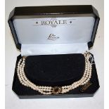 A Lotus Royale simulated pearl three string choker in fitted leather box