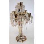 A reproduction brass and glass five sconce table candelabra,
