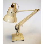 A cream painted anglepoise desk lamp