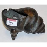 A Chinese bronze brush washer in the form of a conch shell having various character marks width