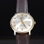 A gents Tissot Seastar 7 Visodate 9ct gold cased wrist watch having signed champagne dial,