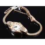 A ladies Tudor 9ct gold cased bracelet watch (lacking glass) having a champagne dial,