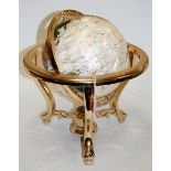 A reproduction brass framed and hardstone inset table top terrestrial globe