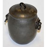 An early 20th century hammered pewter biscuit barrel and cover of barrel form having applied lion