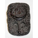 A Chinese clay caligraphy inkwell relief decorated with various dragons character mark verso,
