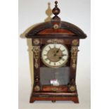 A late 19th century Continental faux walnut cased and brass mounted mantel clock,