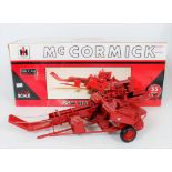 Speccast 1/16th scale resin scale model of a McCormick 55W Hay Baler, finished in red,