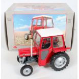 Universal Hobbies 1/16th scale model of a Massey Ferguson 135, with cab, finished in red and white,