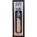 A Puma cricket bat, signed by Andrew Fli