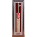 A Gray-Nicolls cricket bat commemorating