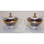 A pair of 20th century Vienna hand painted porcelain cups and covers,