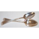 A pair of early 19th century silver stuffing spoons, in the Rat-tail pattern,