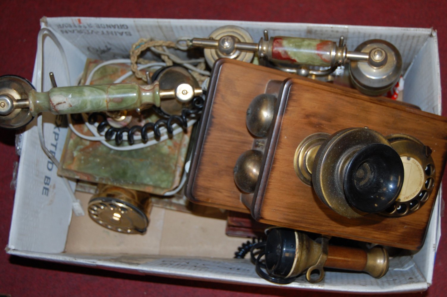 Two 1970s onyx cased telephones together with one other reproduction wall mounted telephone (3)