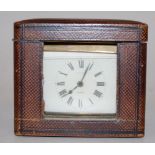 A mid-20th century brass cased carriage clock, having enamelled dial with Roman numerals,