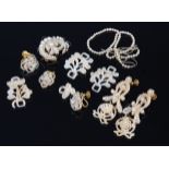 A collection of principally 19th century seed pearl set costume jewellery to include ear clips,