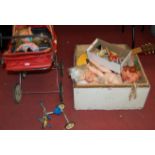 A box of assorted mid-20th century and later celluloid dolls; together with a dolls pram,