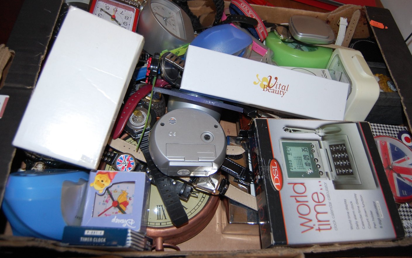 A box of miscellaneous items, to include; travel clocks,