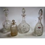 A modern cut glass decanter and stopper of mallet shape having star cut base and floral decoration,