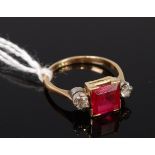 An 18ct gold synthetic ruby and diamond set dress ring, the old cut diamonds each weighing approx.