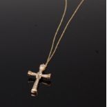 A 9ct gold and diamond set cross pendant, the arms channel set with small graduated brilliants,