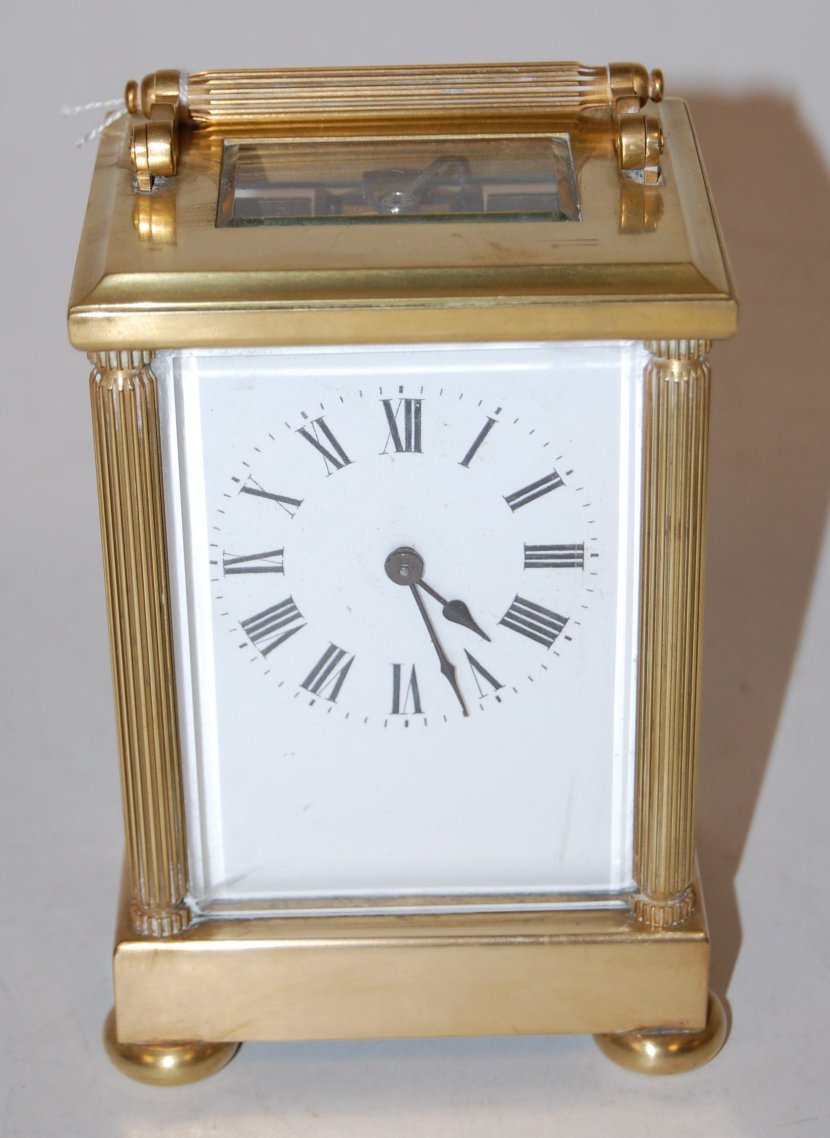 A 20th century lacquered brass cased carriage clock,