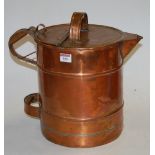 A large Victorian copper water jug with hinged lid,