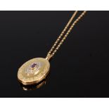 A Victorian style 9ct gold picture locket, centre set with an oval cut amethyst, 2.