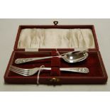 A cased Celtic inspired silver two piece christening set, maker Atkin Bros,