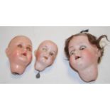 An Ernst Heubach bisque dolls head only, having rolling brown eyes and open mouth,