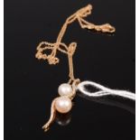 A contemporary cultured pearl and diamond point set pendant, 3.