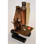 An early 20th century lacquered brass monocular microscope, stamped Watson and numbered B18676, h.