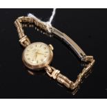 A Baume ladies 9ct gold cased wristwatch, having signed champagne dial, quarter Arabic numerals,
