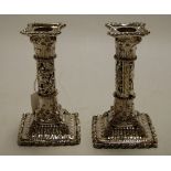 A pair of cast and silver plated table candlesticks, with detachable sconces, h.