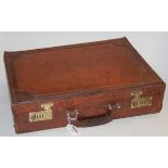 An early 20th century brown stitched leather briefcase,